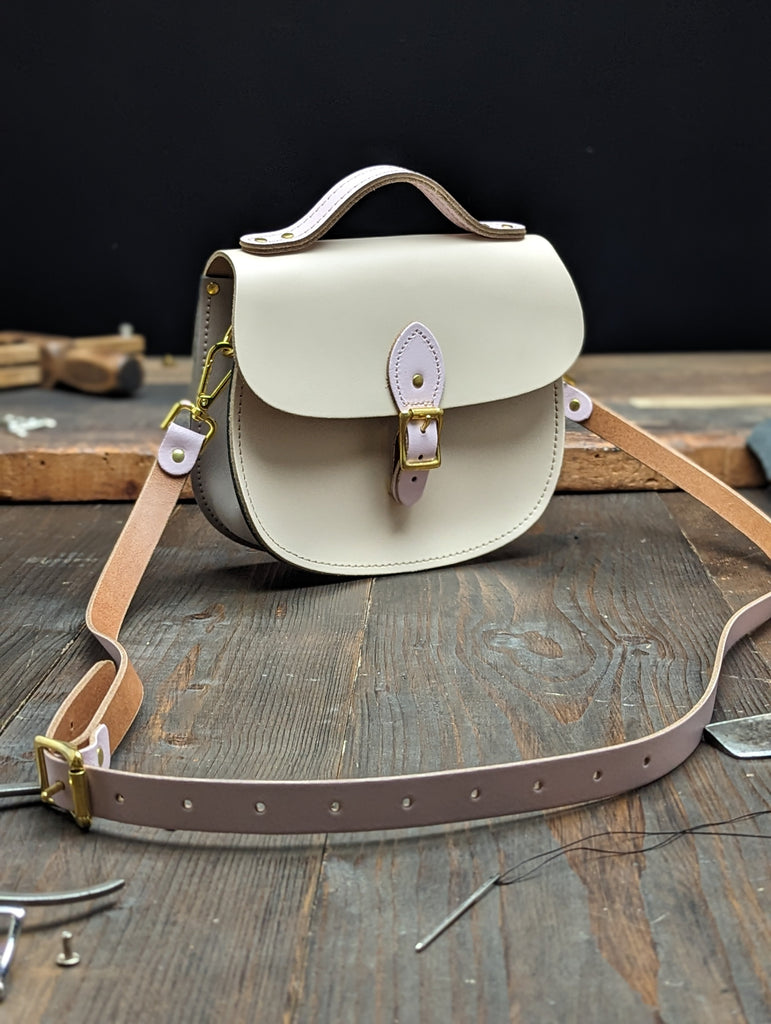 Medium Sporran with a Hidden Magnetic Fastener, Bolt-on Handle, Outer Slip Pocket and Gold Hardware made from Sherbet Lemon and Parma Violet Leathers (MMRP £109)